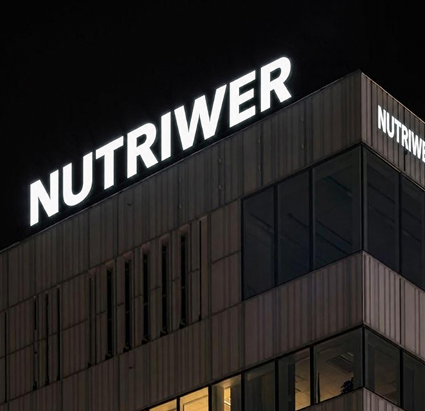 Illuminated rooftop signage letters manufactured by HLW SIGN, photographed at night