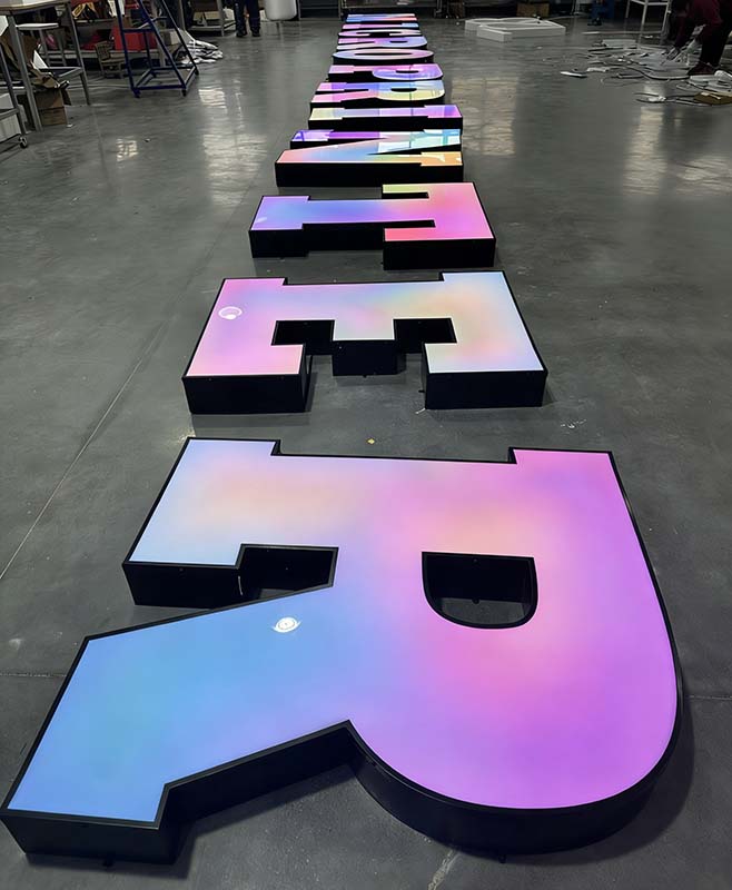 Illuminated gradient letters used to illustrate signage pricing