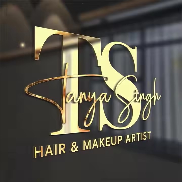 Gold script sign for a hair salon on an interior wall